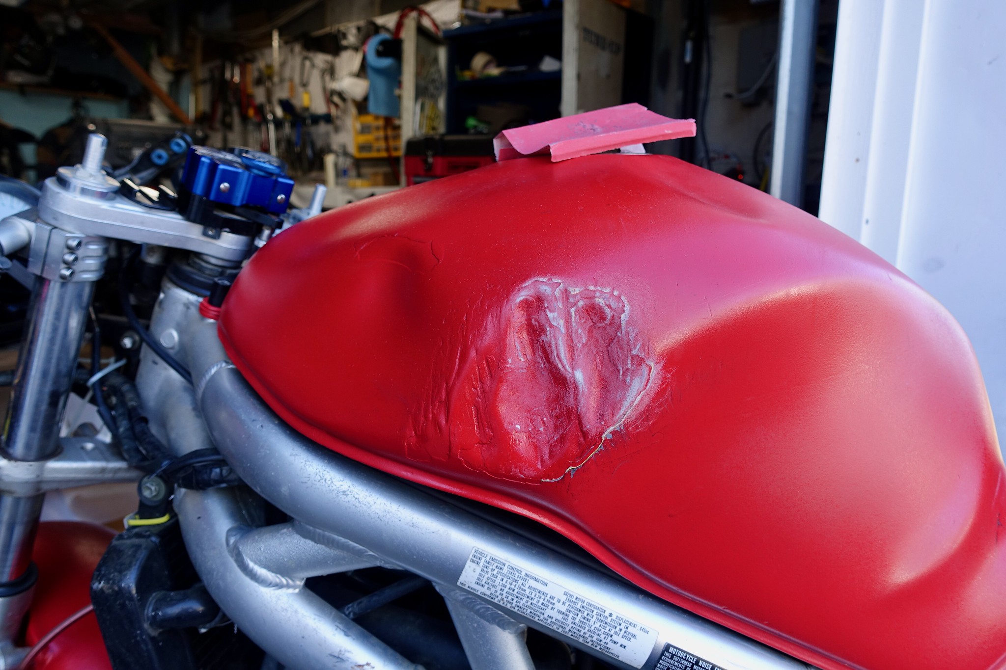 Dented motorcycle tank