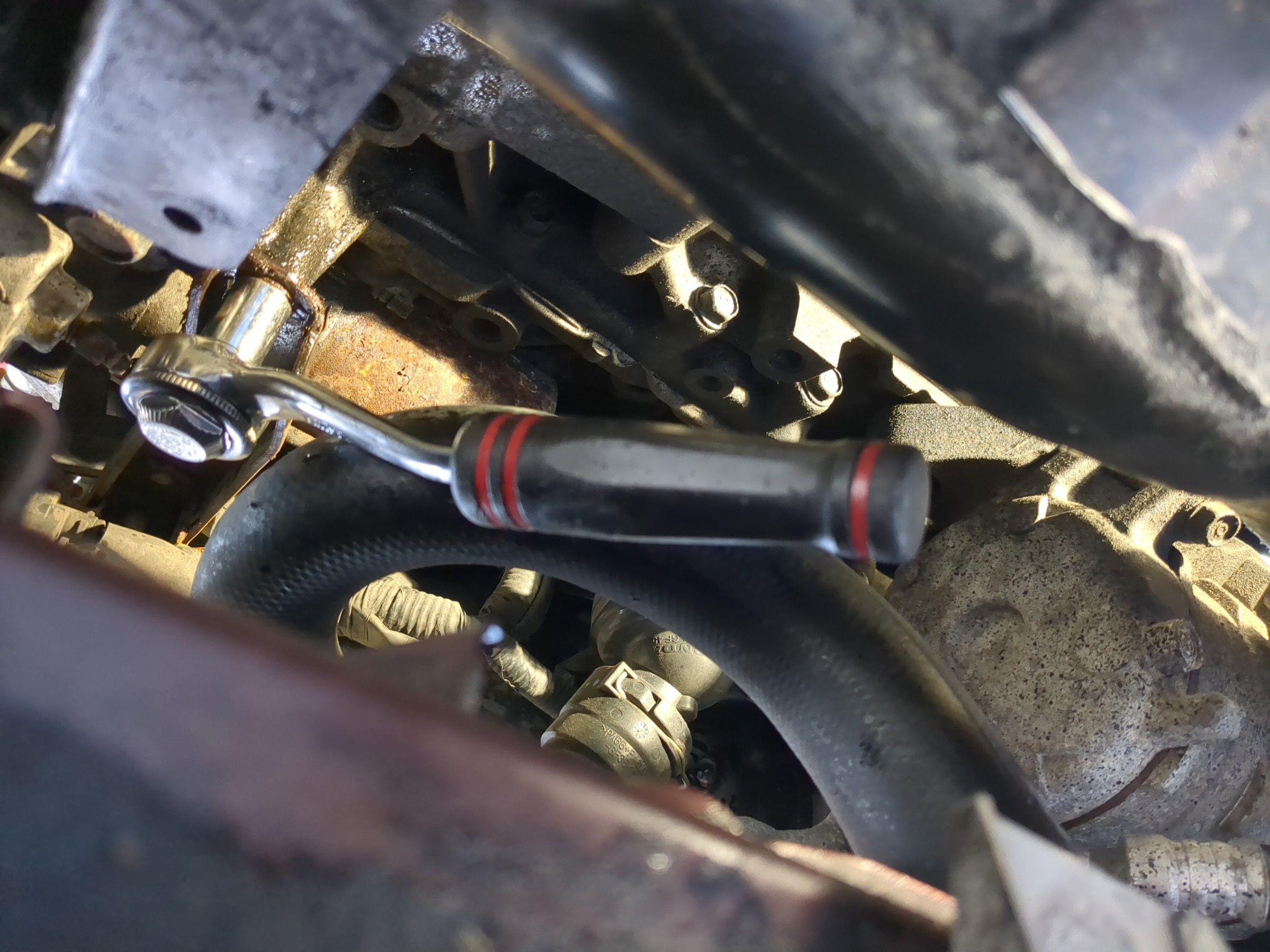 ratchet on intake manifold bolt ready to loosen