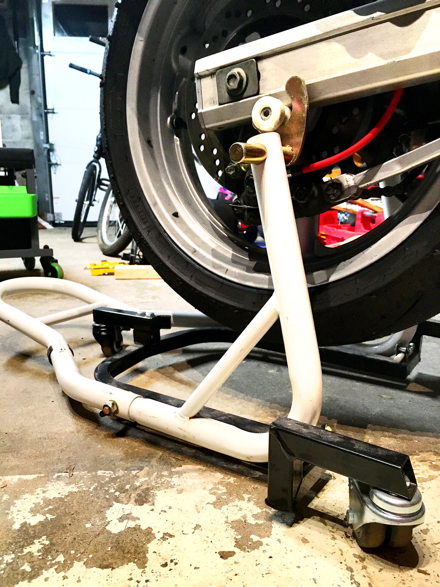 Rear motorcycle wheel on a trolley rear stand